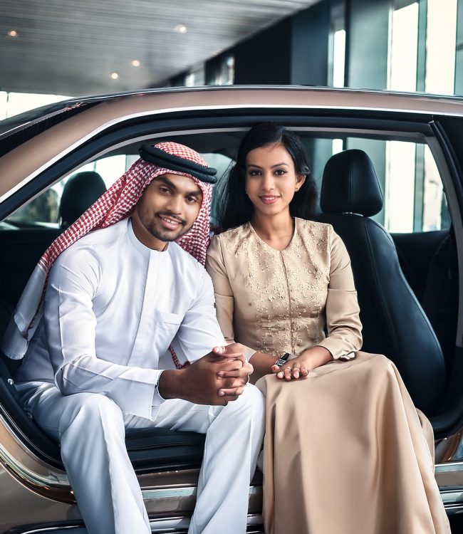 Firefly a qatar arabi man and lady in car in limousine showroom and make it real look 35778